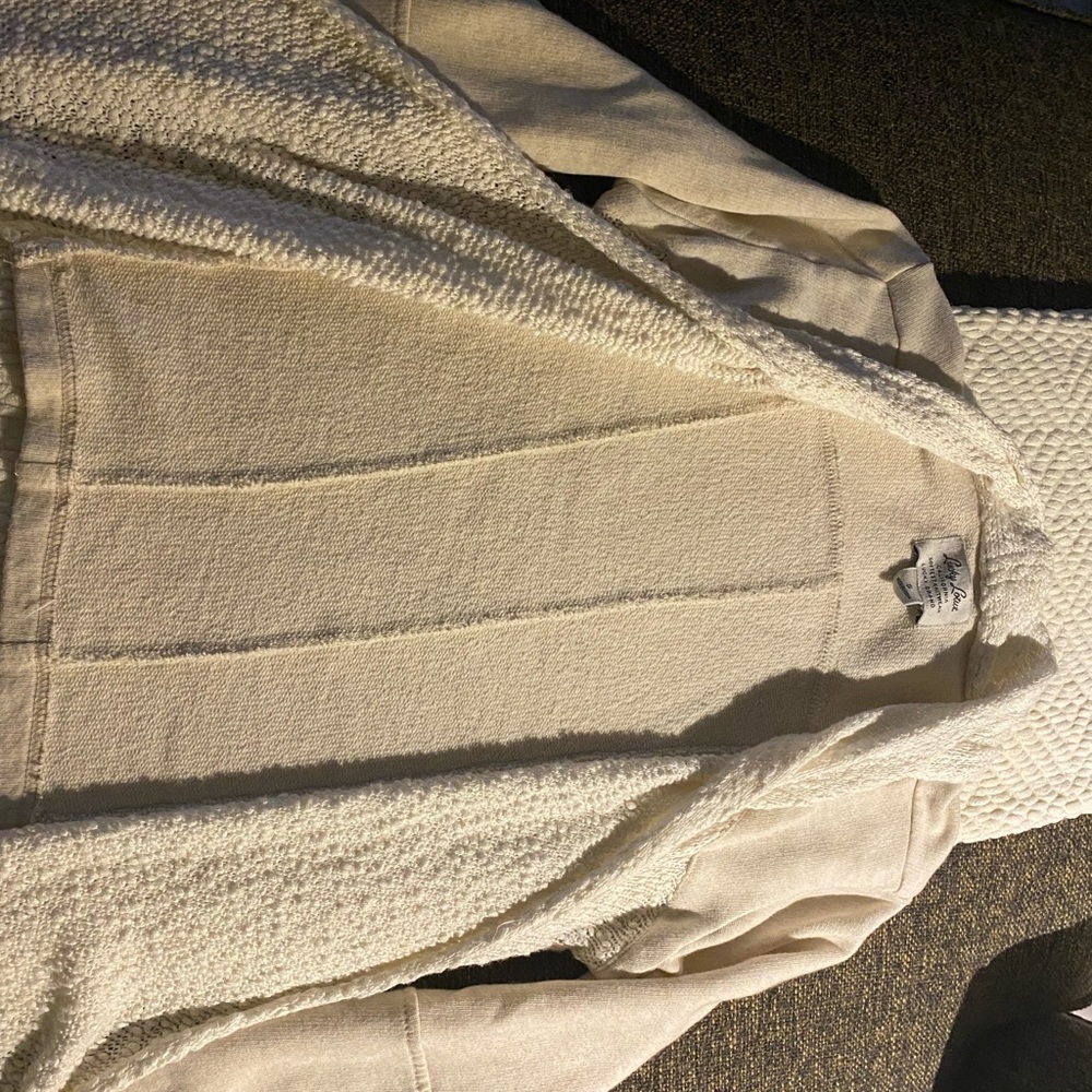 Ivory sweater by Lucky Lotus. Size small. Longer in front. Very soft